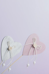 two wooden hearts on purple background, valentine's day concept,copy space.