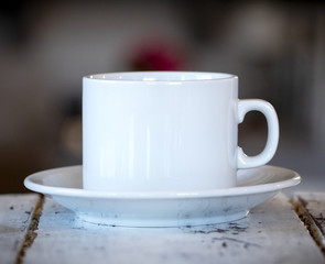 cup of coffee on wooden table