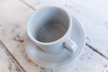 cup of coffee on wooden table