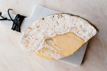 Piece of Turkish Old Kashar Cheese on Marble Surface.