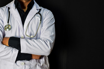 doctor standing on black background. Medical and healthcare concept.