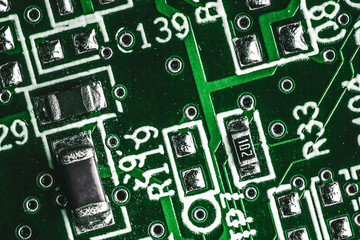 Green electronics technology background. Detailed circuit board texture.