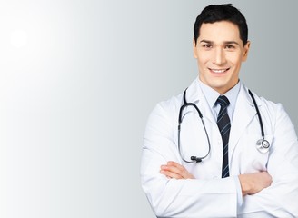 Fototapeta premium Male doctor with stethoscope on hospital background