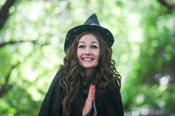 a fairy in a hood and a cloak among