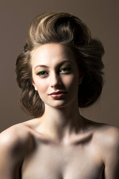 Portrait of shirtless young woman with blond hair
