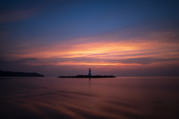 Beautiful Nature Sunset Seascape and Coastline View of Khao Lak Light Beacon Tower at Blue Hour Twilight Sky ,Phang Nga, Thailand