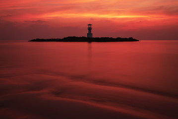 Obraz na płótnie Canvas Scenic Seascape of Khaolak Light Beacon Tower in the Sea of Red Twilight Sky Natural Long Exposure Landscape Sunset Time ,Phang Nga, Thailand