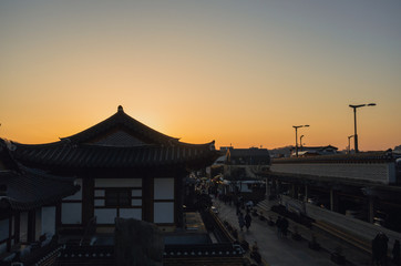 Fototapeta na wymiar Old Korean traditional house on sunset