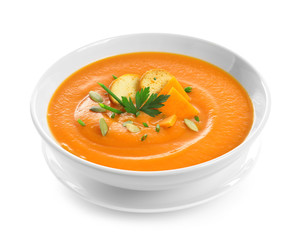 Dish with pumpkin cream soup on white background. Healthy food