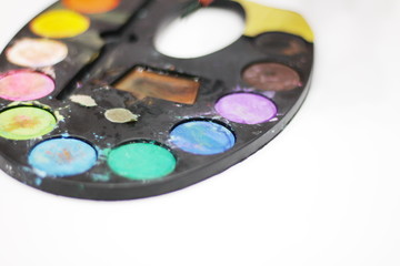 a three-year-old girl in a creative game with watercolor.-image