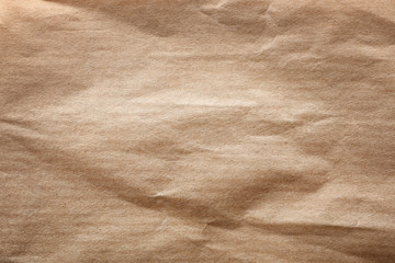 Brown paper bag texture as background, top view