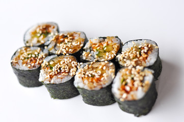 Unagi maki rolls with eel and cucumber on white background