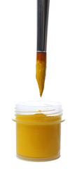 Brush and plastic jar with paint isolated on white