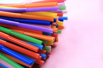 Colorful plastic drinking straws close up