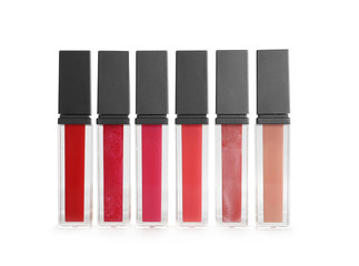 Different colour lipsticks on white background. Cosmetic product