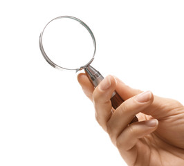 Woman holding magnifying glass on white background, closeup