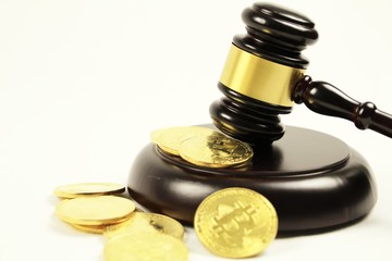 Golden bitcoins and judge gavel