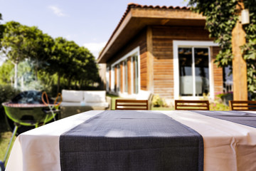 Wooden desk of free space and grill time in garden 