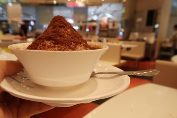 Chocolate cool dessert Bingsu, White ice snow flake with fresh milk.