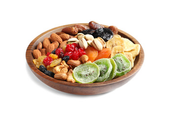 Bowl with different dried fruits and nuts on white background