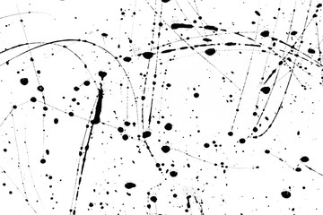 Splashes of black paint on a white background. black paint  following stains