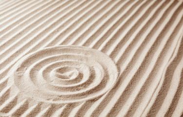 Zen garden pattern on sand. Meditation and harmony