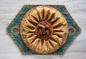 Arab sweets. Arabian pancake stuffed with sweet cheese and pistachios.
