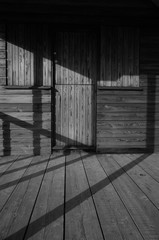 Timber hut, Jersey, U.K. B&W abstract image of texture and light.