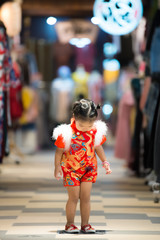 Portrait of cute little girl asian woman in Cheongsam dress,Thailand people,Happy Chinese new year concept