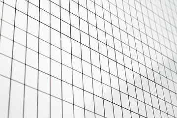 Straight black lines make the grid on a white surface. 