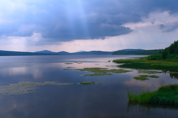 Dark rain clouds over Lake Zyuratkul