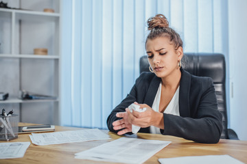 Young business girl in office working with documents. During this, they are browsing them. Hurling...
