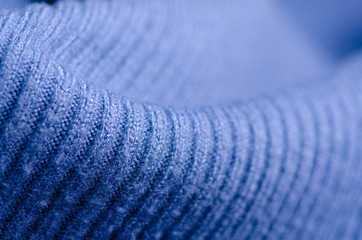 Fabric warm blue sweater textile material texture blur background macro