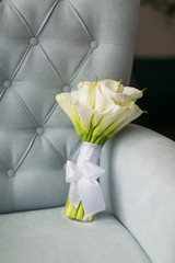 The beautiful bouquet of flowers on a sofa indoor