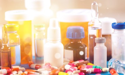 Colorful pills and tablets on background