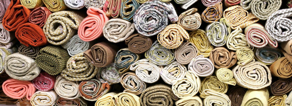 Rolls Of Fabrics On The Shelves