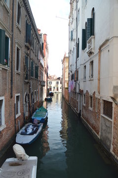 Narrow Canal Of The Lustraferi River With Beautiful Boats Moored Shot From The Bridge In The Fondamenta De La Misericordia In Venice. Travel, holidays, architecture. March 28, 2015. Venice, Italy.