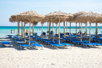 straw sun umbrellas on Elafonisi beach in Crete