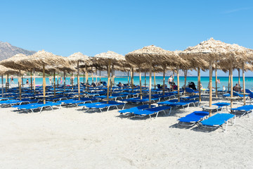 straw sun umbrellas on Elafonisi beach in Crete