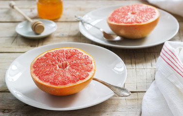 Vegetarian breakfast for two of oatmeal, baked grapefruit and tea. Rustic style.