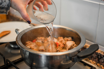 Preparing lunch for the family. Cooking in a kitchen.