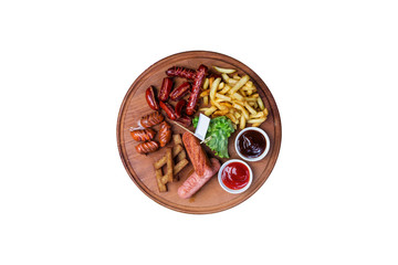 Beer snacks set. Grilled sausages and french fries served with tomato and BBQ sauce.