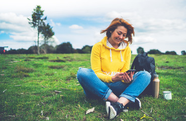 smile woman holding in female hands gadget technology, tourist young girl text message on background green grass using mobile smartphone, hiker enjoy recreation, online wifi internet lifestyle concept