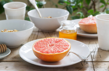 Vegetarian breakfast for two of oatmeal, baked grapefruit and tea. Rustic style.