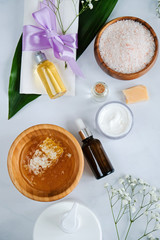 Spa natural skin care products background, cosmetic products creative layout, top view, vertical lat lay