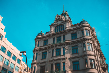 Historic European building facade and blue sky © Novanture