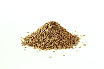 heap of Cumin or caraway seeds isolated on white background