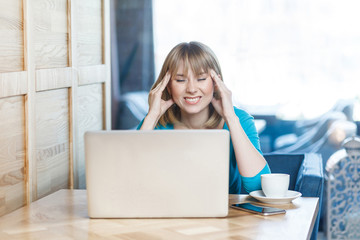 Be waiting an idea! Portrait of thoughtful attractive young girl freelancer in blue blouse are...