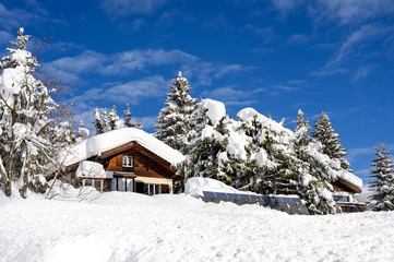 Wood chalet in winter resort Davos, Switzerland.