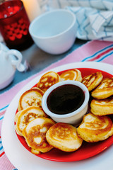 Tasty baked pancakes with strawberry jam